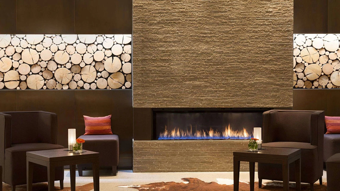 Fireside view of lobby and lounge at Trademark property