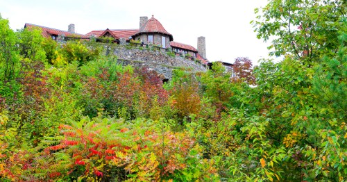 Colorful greenery surrounds the Lucknow Mansion castle home at the Castle in the Clouds attraction in Moultonborough, New Hampshire.