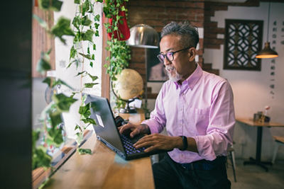 Asian freelancer working at cafe