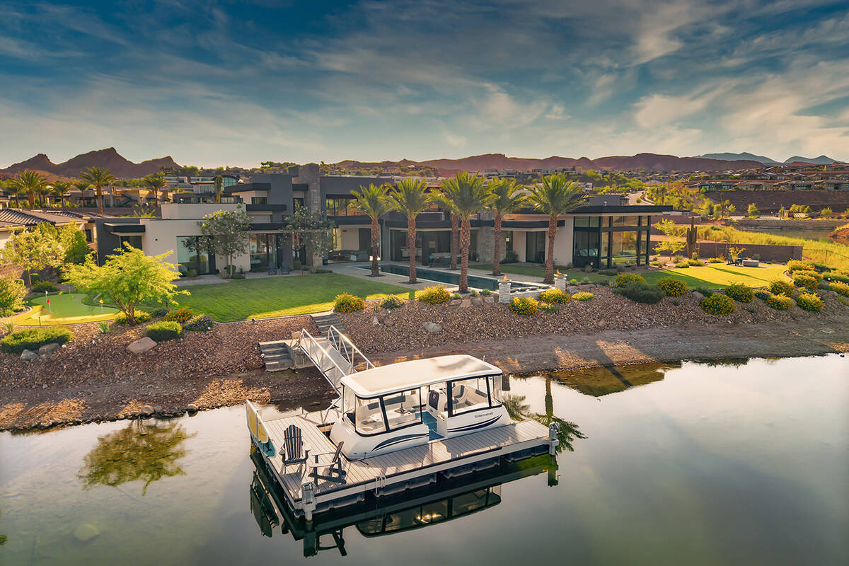 The mansion at North Shore of Lake Las Vegas has a private boat dock for an electric boat and i ...