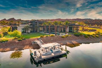 The mansion at North Shore of Lake Las Vegas has a private boat dock for an electric boat and i ...