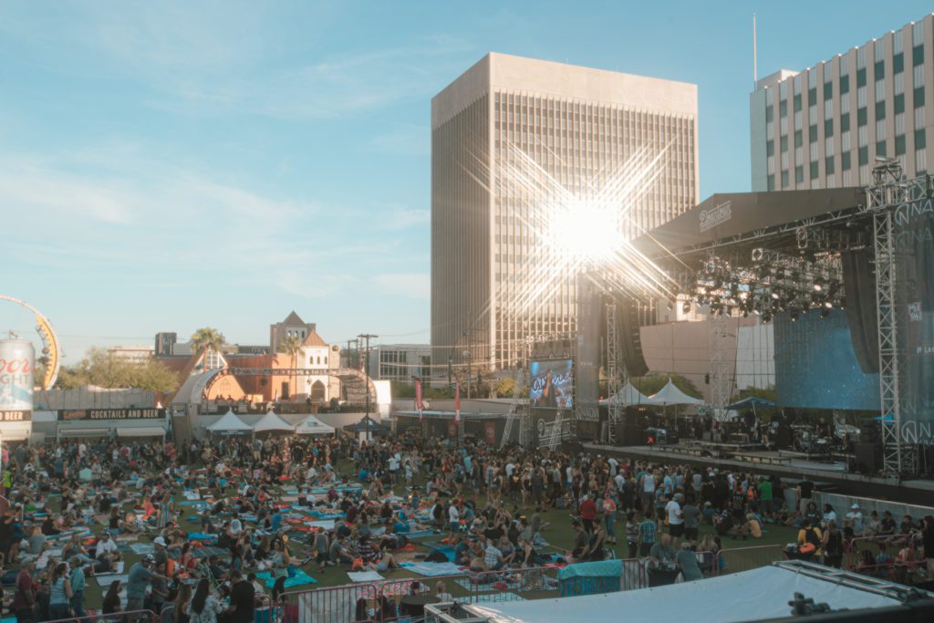 Reggae Crowd watching the stage in grass area.