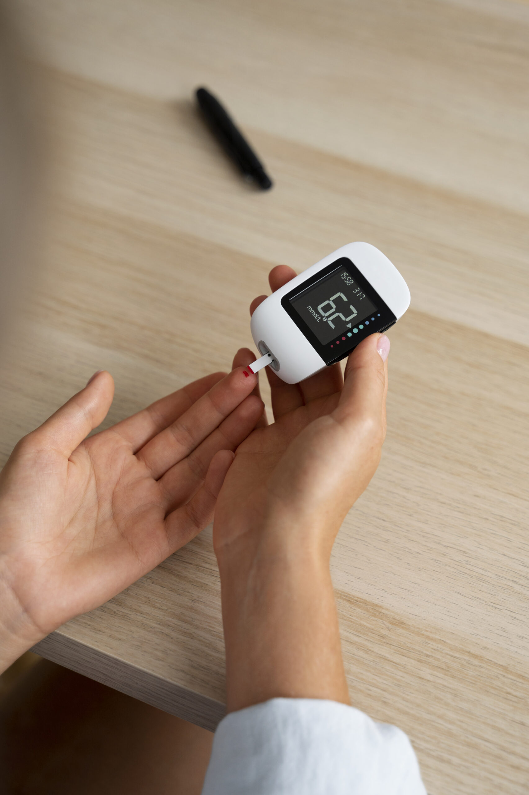 diabetic person checking their glucose level scaled