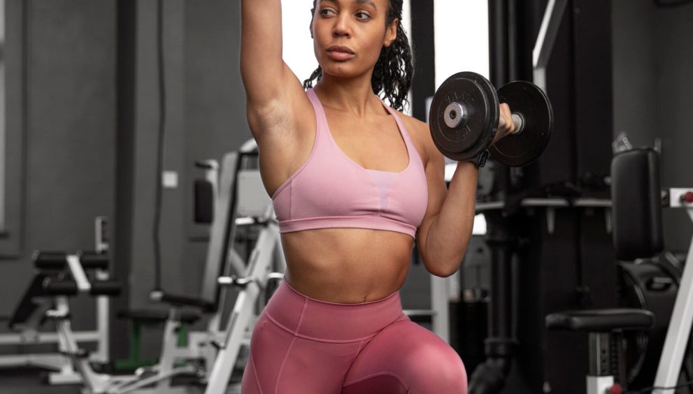 woman training weightlifting gym scaled