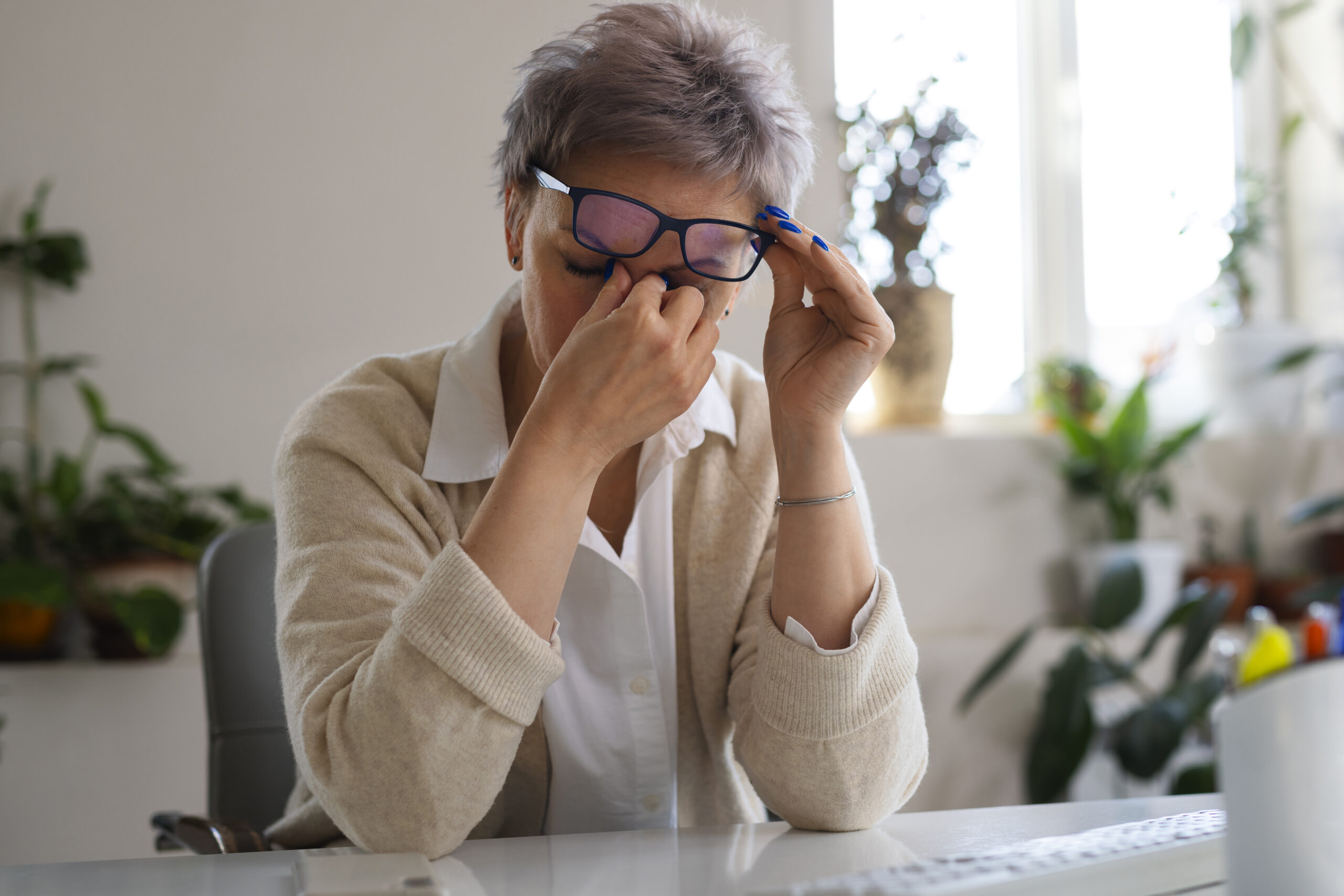 medium shot woman sitting desk