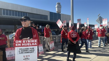 Culinary members picketed near the Terminal 3 passenger drop-off lane, passing out leaflets to travelers encouraging them to eat at other airport locations.