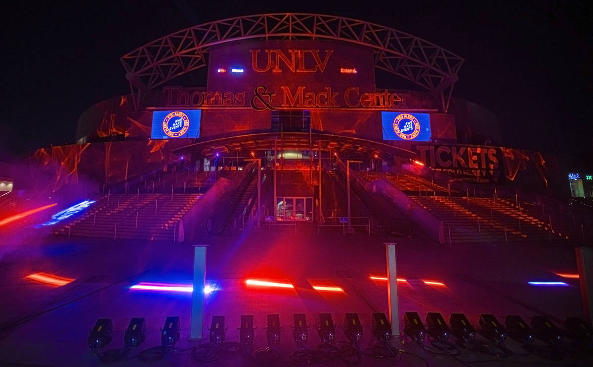 The Thomas and Mack Center glows red as part of a show of solidarity with live events workers i ...