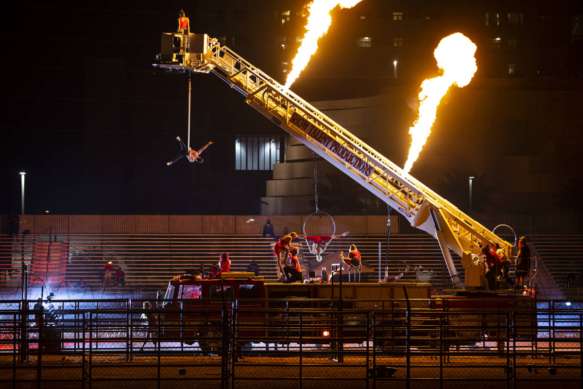 People perform at the Core Arena at the Plaza for the "Red Alert" campaign in downtow ...