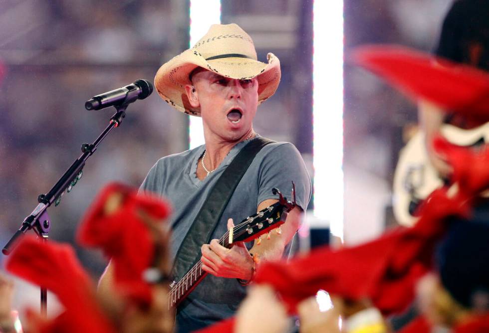 FILE – In this Nov. 22, 2012, file photo, country singer Kenny Chesney performs during ha ...