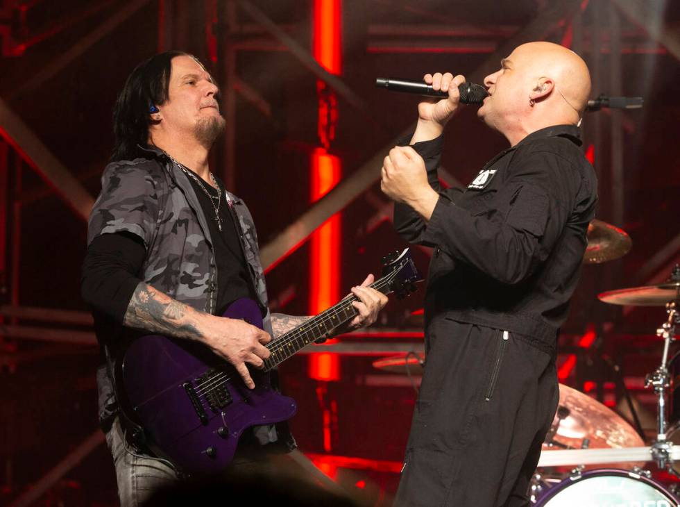 Dan Donegan, left, and David Draiman of Disturbed perform on Wednesday, April 2, 2025, at Wells ...