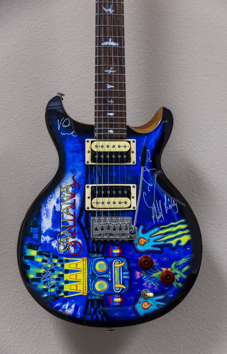 An autographed guitar hanging on the wall of Carlos Santana’s office on Wednesday, April ...