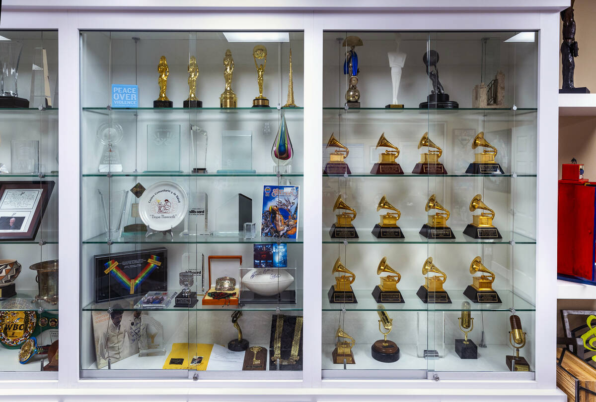 A cabinet full of Carlos Santana’s awards and memorabilia at his office on Wednesday, Apr ...