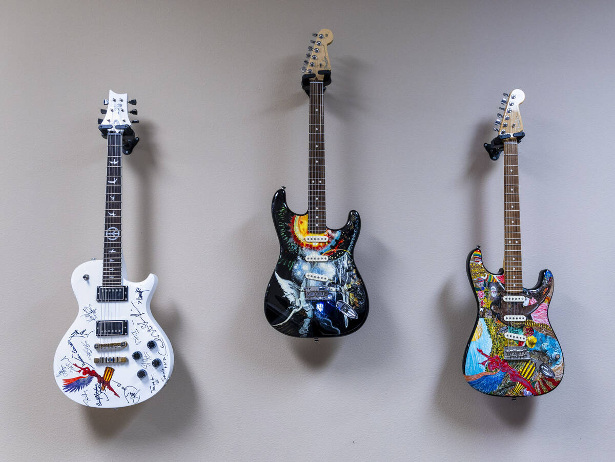 Autographed guitars hanging on the wall of Carlos Santana’s office on Wednesday, April 2, ...