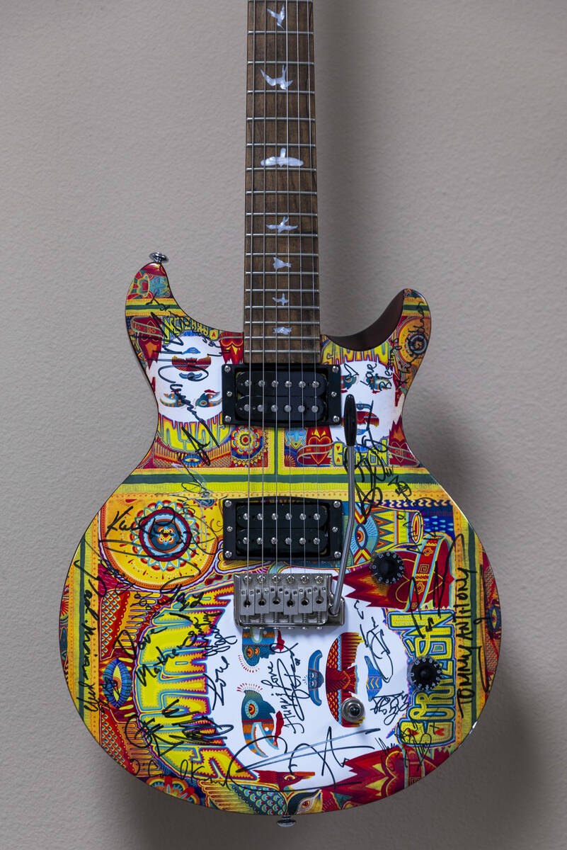 An autographed guitar hanging on the wall of Carlos Santana’s office on Wednesday, April ...