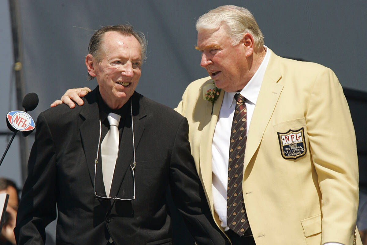Former Oakland Raiders coach John Madden, right, puts his arm around Raiders owner Al Davis aft ...