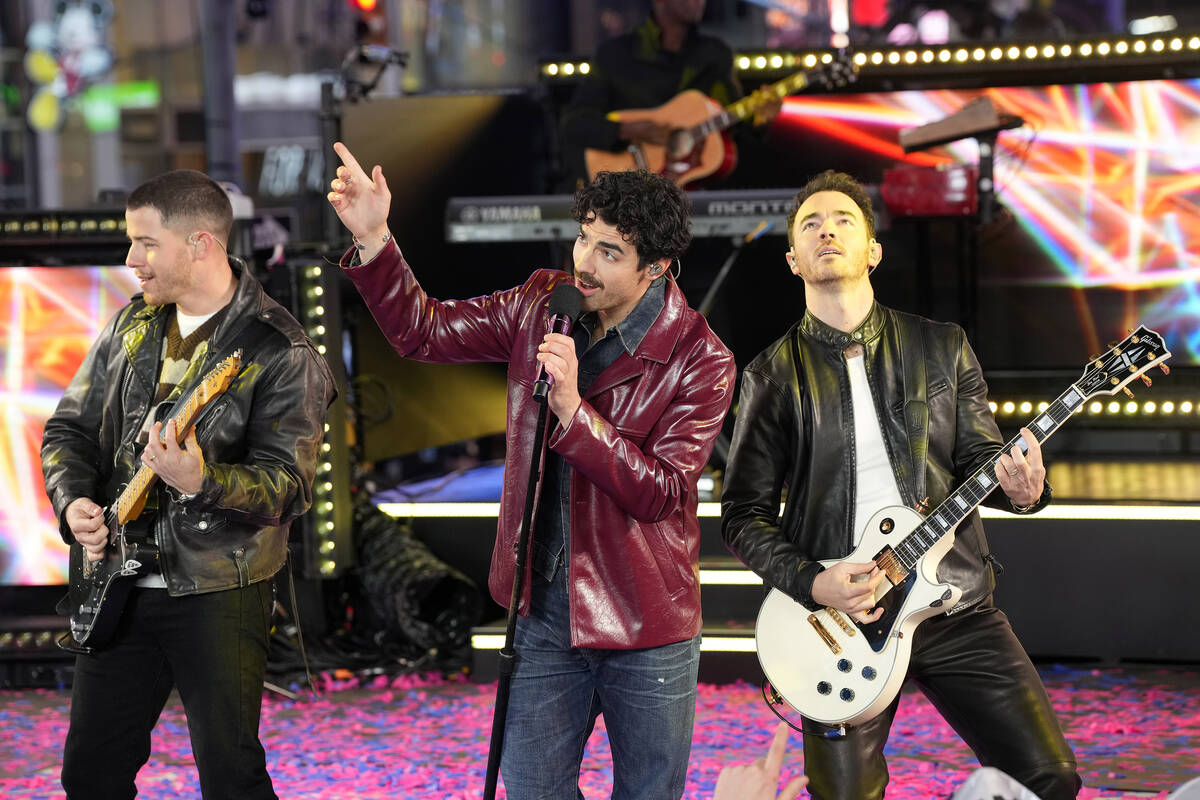 Nick Jonas, from left, Joe Jonas and Kevin Jonas from the Jonas Brothers perform during the Tim ...