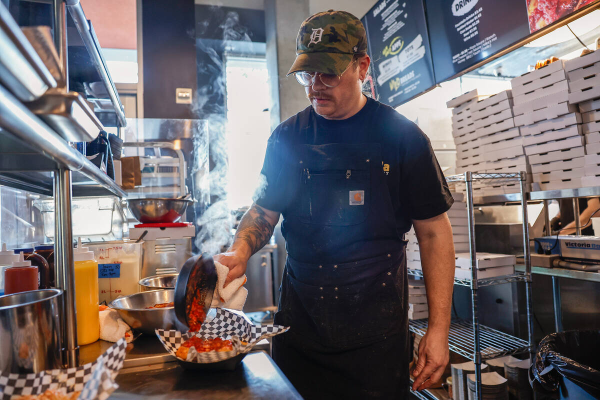 Chef-owner Robby Cunningham works in the kitchen at Guerrilla Pizza Wednesday, Dec. 3, 2025 in ...