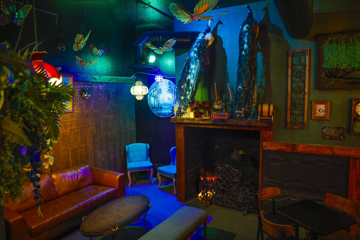 The lounge leading into The Dark Arts room through the fireplace at Grey Witch is photographed ...