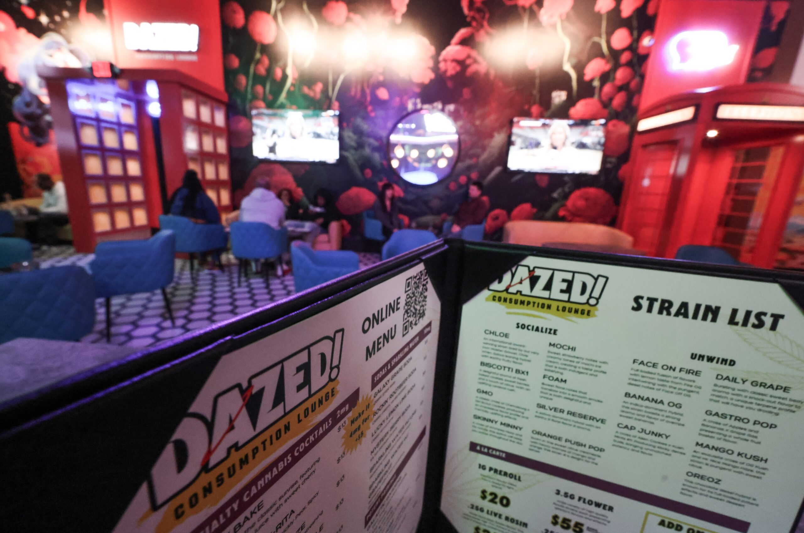 A menu lists a selection of products at Dazed! consumption lounge inside Planet 13.