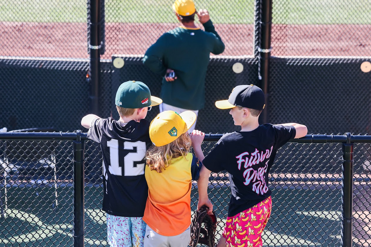 Young fans look over the Athletics bullpen in between innings of a spring training game with the Arizona Diamondbacks during Big League Weekend at Las Vegas Ballpark on March 8, 2025.
