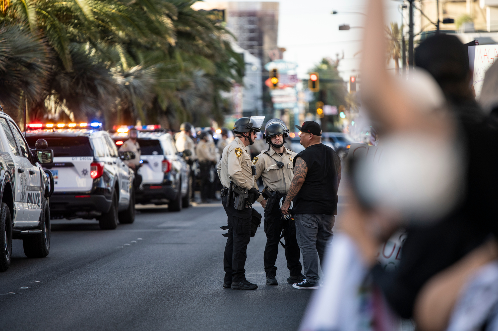 Police talk to a demonstrator during a “No Kings” anti-Trump event on Las Vegas Boulevard in front of the Lloyd D. George Federal Courthouse in downtown Las Vegas.