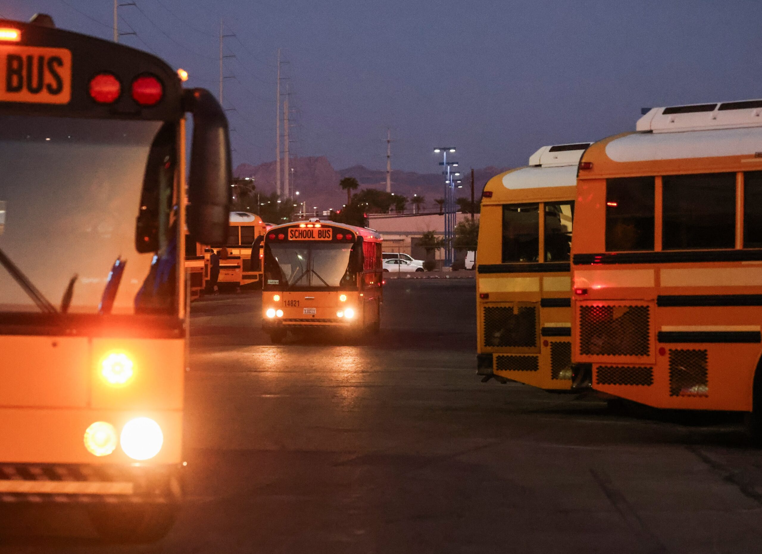Clark County School District buses leave the Arville Transportation Yard.