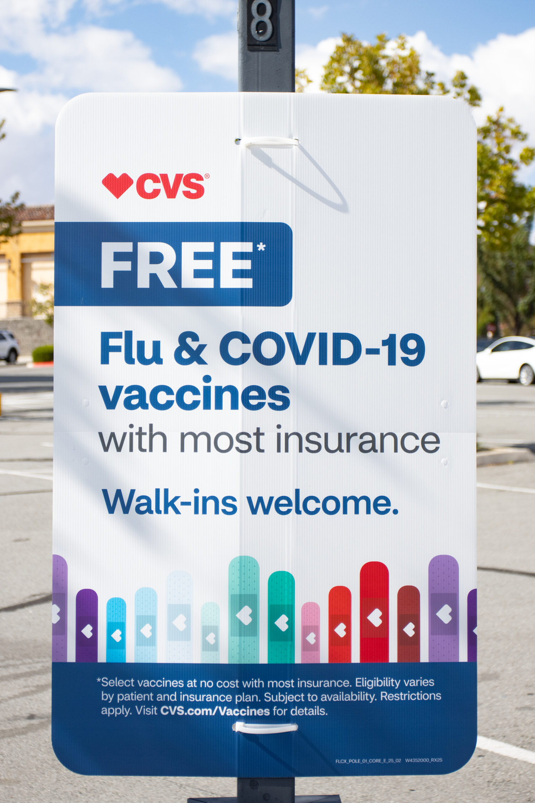 A sign in the parking lot of a CVS Pharmacy promoting free flu and COVID-19 vaccines in Sparks.