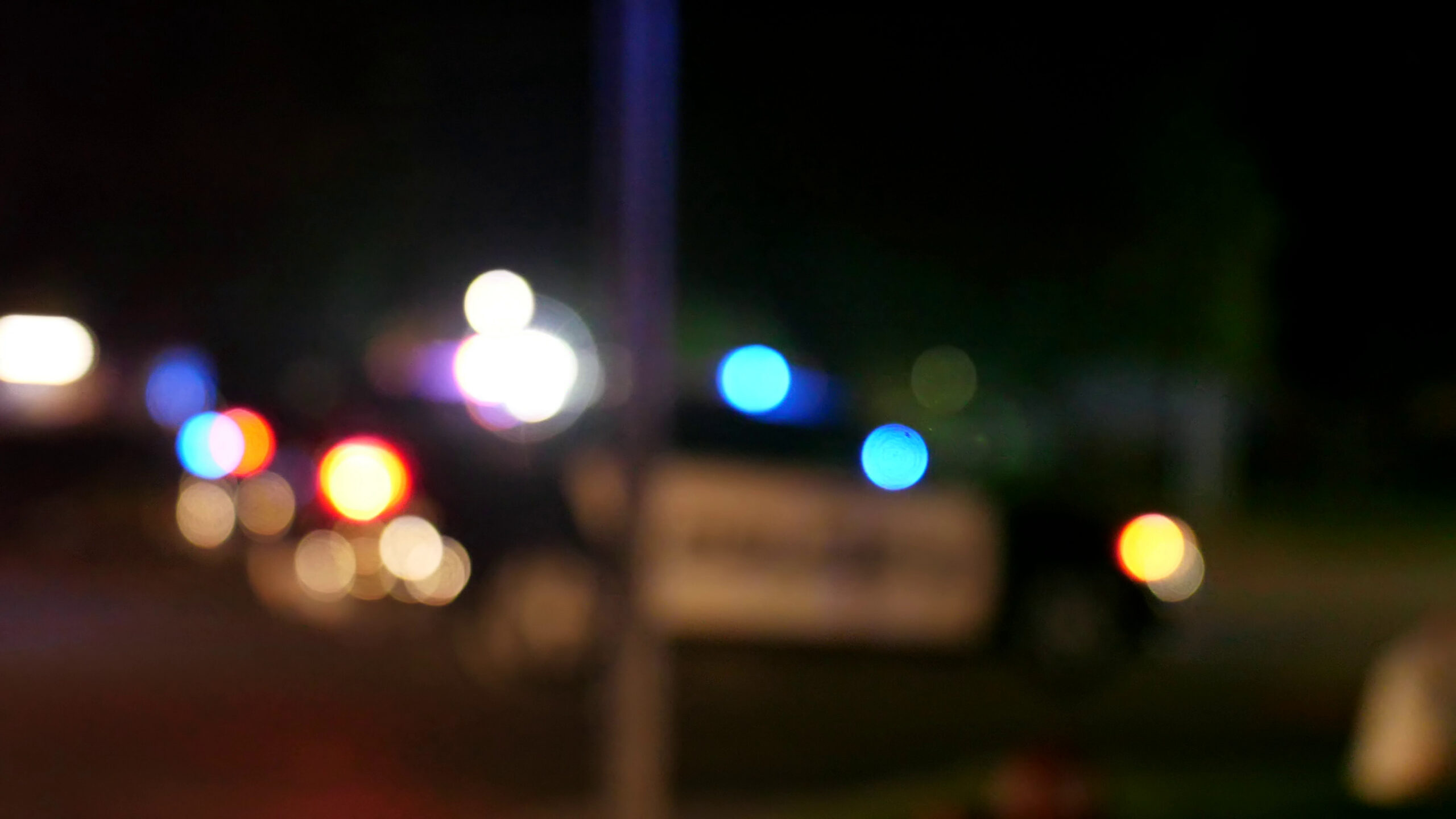 Police car with emergency lights flashing.