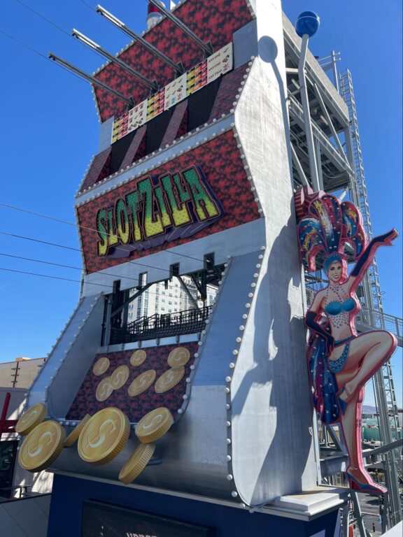 More Than You Ever Wanted To Know About Parking at Fremont Street Experience 8 The ZipZilla and Super-Hero Zoom ziplines, the famous Vegas showgirl, the coins toppling out of SlotZilla and the massive slot machine handle.