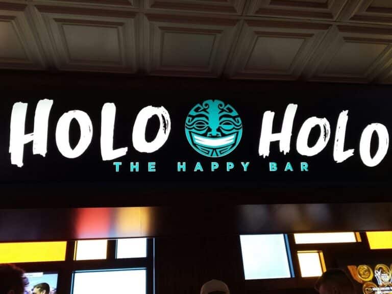 The Cal - Holo Holo - The Happy Bar 2 The sign for Holo Holo - The Happy Bar. Photo from Yelp.