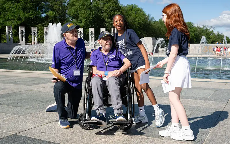 Vietnam Veterans are greeted by students in Washington DC