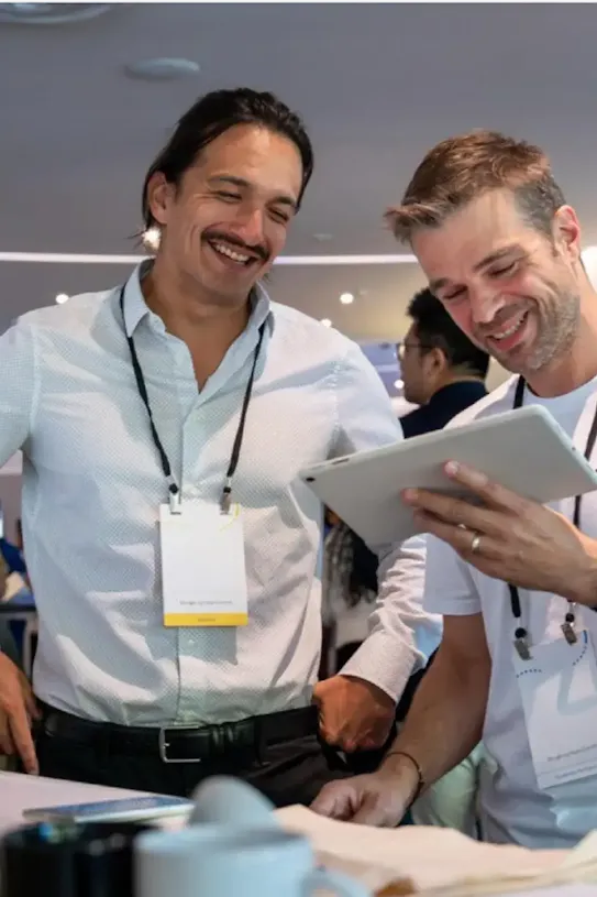 People looking at a tablet