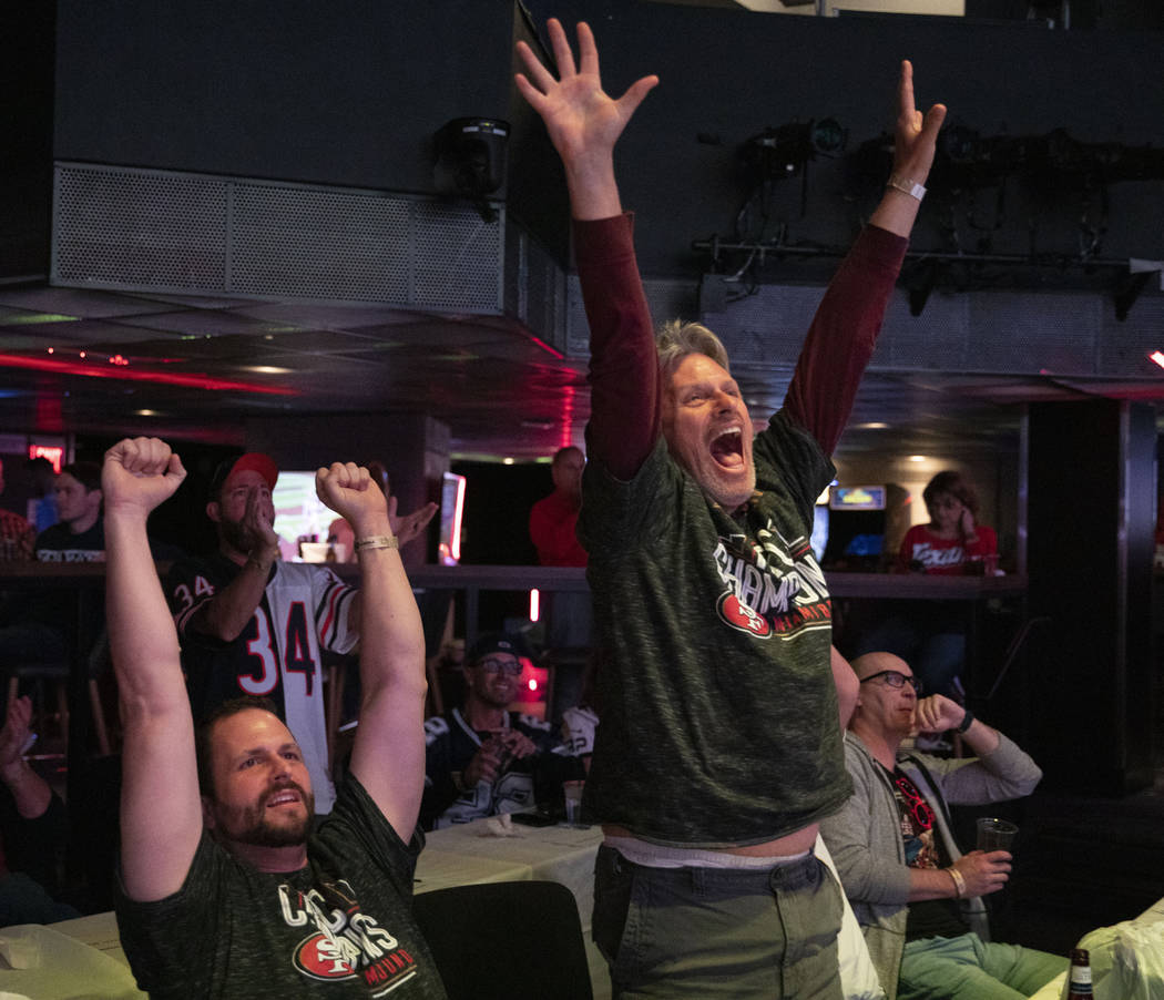 Matt Myers of Flagstaff, Arizona, left, and Michael Myers of Phoenix, Arizona, cheer for the Sa ...