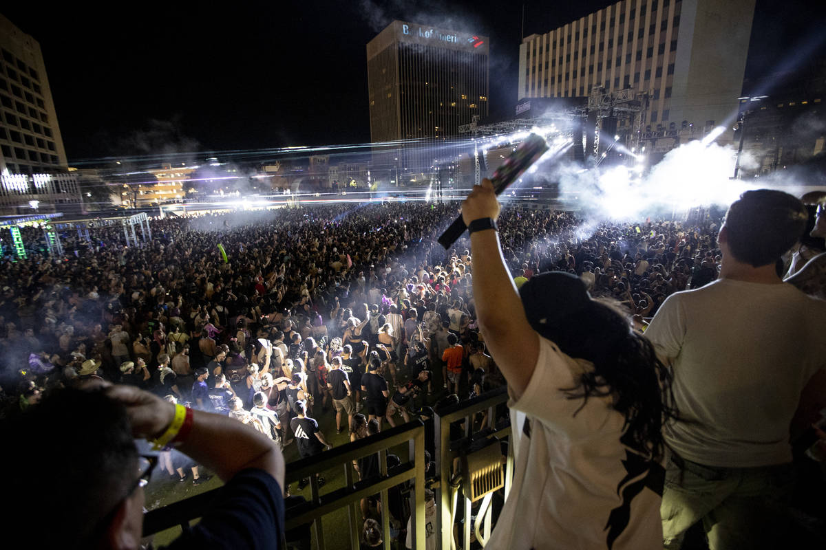 People dance to Excision performing at the Downtown Las Vegas Events Center in Las Vegas, Satur ...