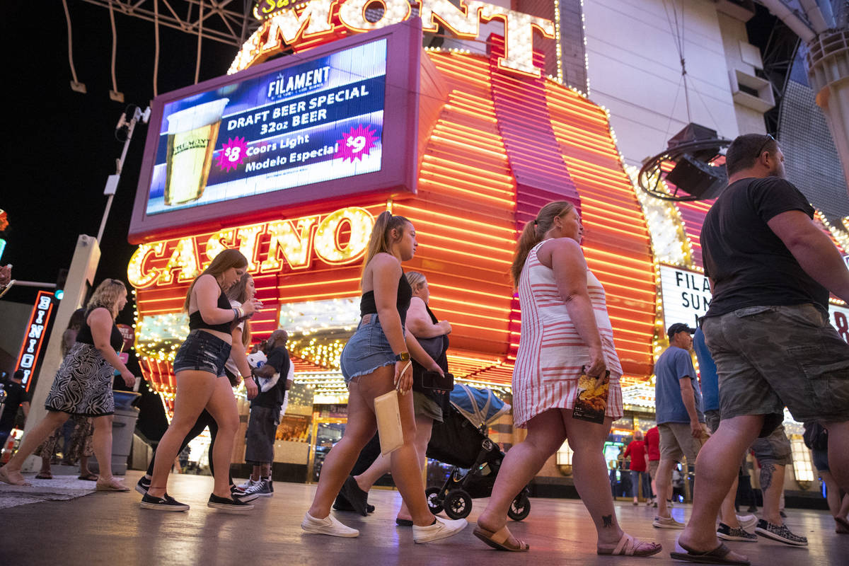 People visit the Fremont Street Experience in Las Vegas, Friday, July 2, 2021. (Erik Verduzco / ...