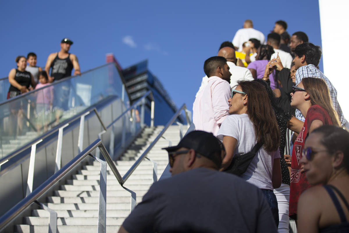 People visit the Strip near Planet Hollywood hotel-casino in Las Vegas, Saturday, July 3, 2021. ...