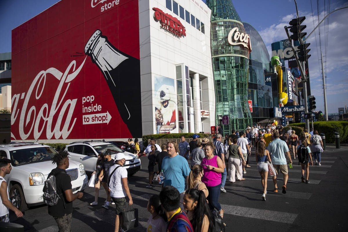 People visit the Strip near MGM Grand hotel-casino in Las Vegas, Saturday, July 3, 2021. (Erik ...