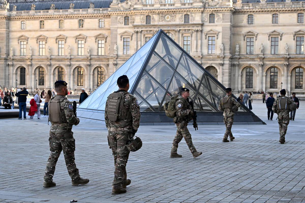 Soldiers patrol in the courtyard of the Louvre museum, Thursday, Oct. 30, 2025 in Paris. (AP Ph ...