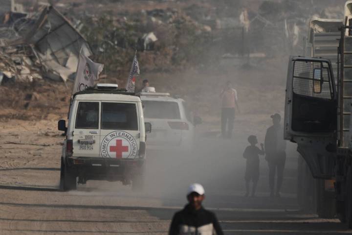 Red Cross convoy carrying what Hamas claims is the remains of an Israeli soldier who was killed ...