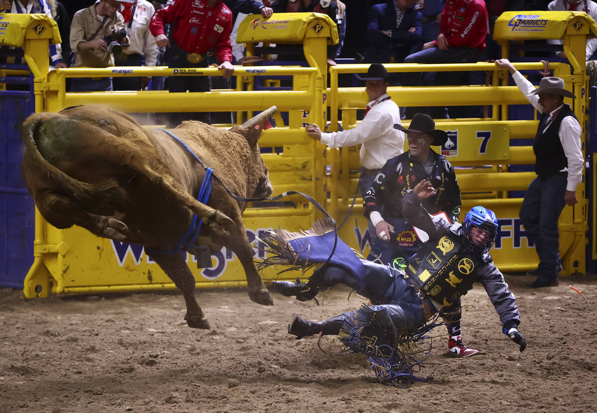Tristen Hutchings gets knocked off of Best Chance while competing in bull riding during the ope ...
