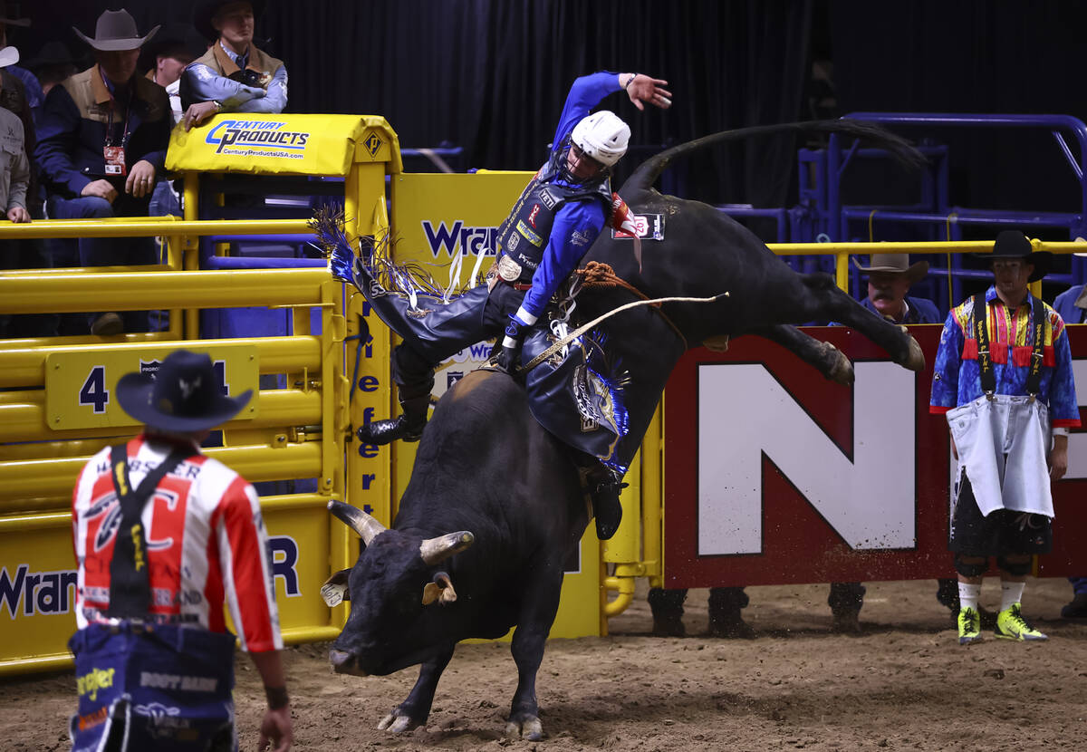 Stetson Wright competes in bull riding during the opening day of the National Finals Rodeo at t ...