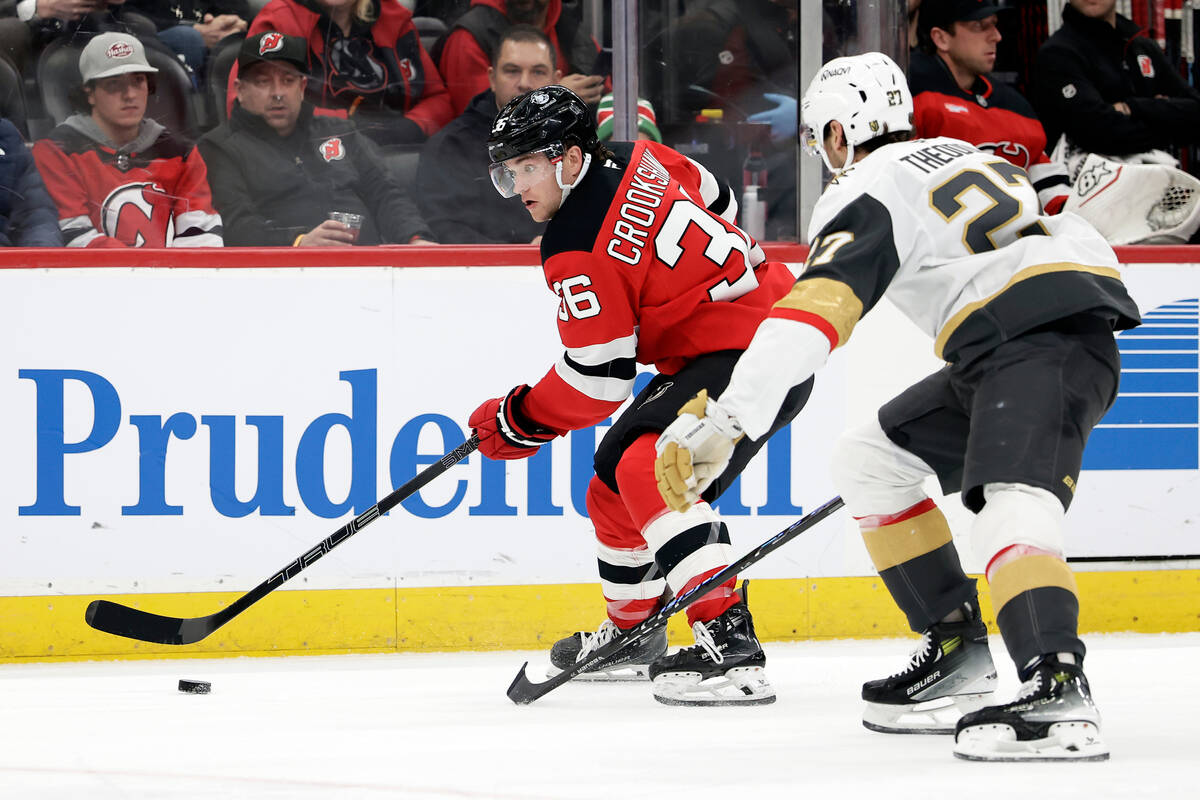New Jersey Devils center Angus Crookshank (36) controls the puck past Vegas Golden Knights defe ...