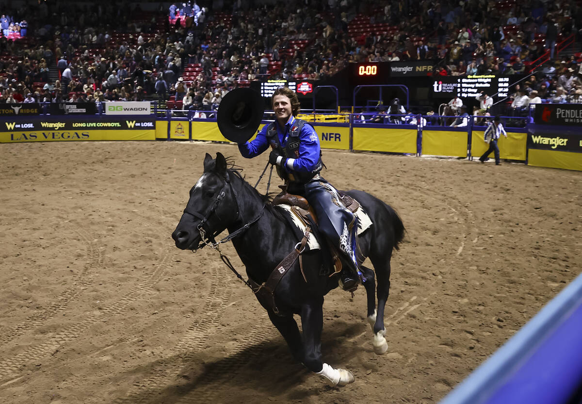 Stetson Wright celebrates after winning in bull riding during the opening day of the National F ...